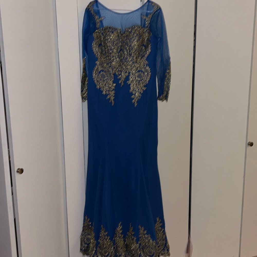 A blue dress with gold design.